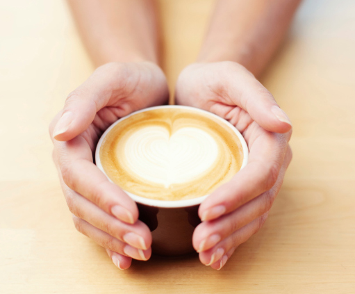 Female hands holding caffee